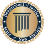 The image is the New Mexico Department of Justice primary seal. This seal is framed with gold gradient rope and a slim gold bar followed by a thicker dark blue circular bar that has white text that reads, "State of New Mexico" at the bottom and "Department of Justice" at the top. At the center of the seal is a gradient circle with a dark blue roman-inspired Pillar in the shape of New Mexico.